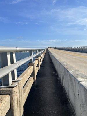 Running up the causeway pedestrian path toward Navarre