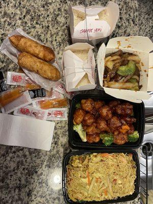 Egg rolls, orange chicken, singapore rice noodles, black pepper beef, and rice