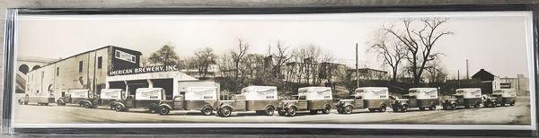 Trucks on display, framed by The Framery