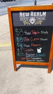 Reverse side  of billboard with Tequila shot specials.