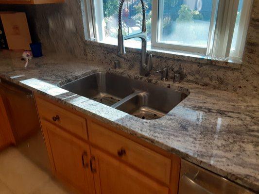 Undermount sink, beautifully cut and polished granite.