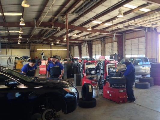 Oil manager, Tire service managers and ASE certified mechanics are all working on vehicles according to their area of expertise.