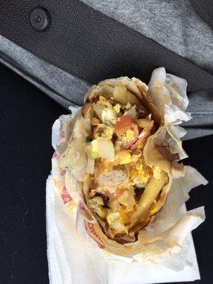 "Sausage and bacon" breakfast burrito with cheese pico and French fries they do not use hash browns or potatoes.