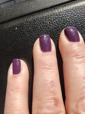 Uneven polish and bumpy topcoat. (click on pic to see detail) I don't have the shiny smooth surface that I love after a good manicure.