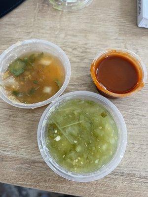 Orange and green mild salsa. Red hot sauce