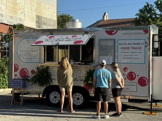 People lining up for Bacon & Bubbles