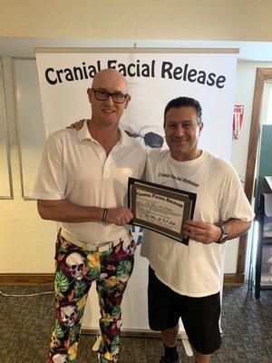 Dr. Perkins receiving his certification for advanced training in Cranial Facial Release.