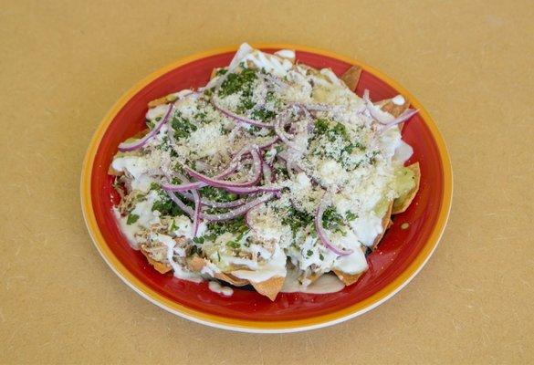 Carnitas Chilaquiles with a mild green poblano salsa