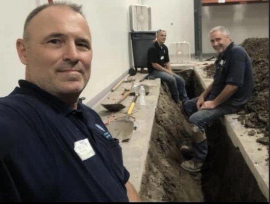 Owner Joe, Billy and Koty are hard at work replacing a bad section of sewer drain piping in a local food processing facility.