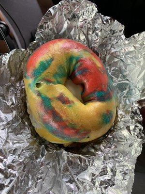 Sausage egg and cheese on a rainbow bagel