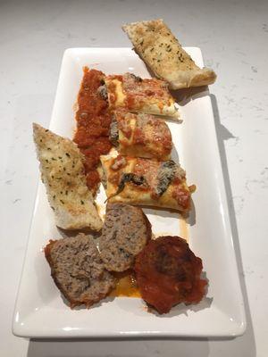 Pasta rollatini sample platter with 3 different fillings. Served with homemade meatball and garlic bread