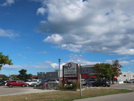 Signage for their store and a strip mall.