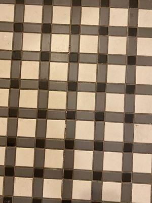 Lack of grout = leaks into flooring