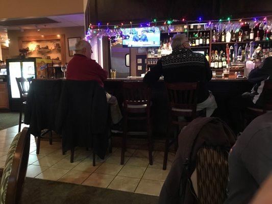 12/8/21  Folks enjoying cocktails & conversation at the bar in Violi's Restaurant.