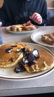 Plain pancakes with a couple Oreos sprinkled on top. Pancake on the right had M&M's inside...so strange