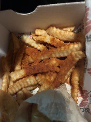 Just tossed the Cajun seasoning into one spot and didn't even shake it around. Once spread out the fries were good and warm.