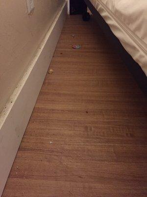 Filthy floors with crumbled cookie pieces, beer bottle tops, popcorn kernels and dirt everywhere. Absolutely disgusting.