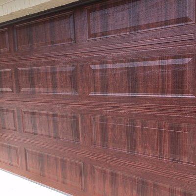 A garage door 16x7 long panel color mahogany different sizes are available 9x7  8x7 10x7