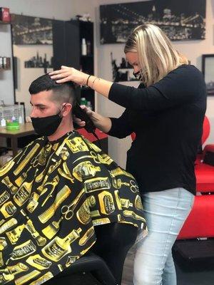 ashley is one of our skilled barbers in action doing a skin fade.