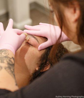 Eyebrows shaping done with our natural sugar paste