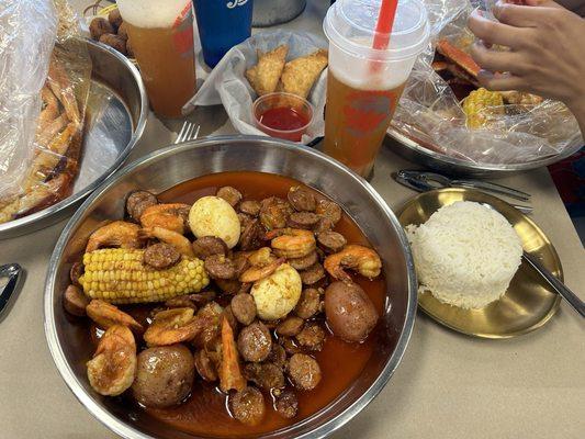 Shrimp Headless sausage eggs potatoes  corn side of white rice