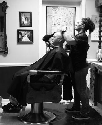 Marny the Barber finishing up a fresh fade.