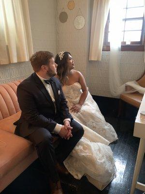 Couple sitting in the bridal suite.