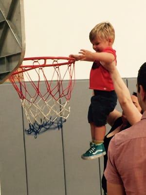 A little help for a little one's basketball shot.