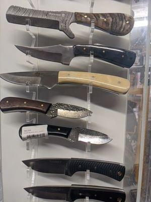 Huge knife selection and custom sheaths made in house.