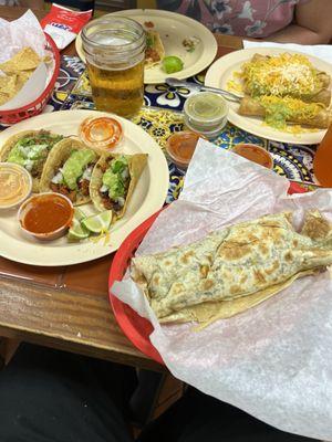 Carne Asada burrito and three street tacos