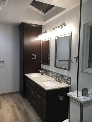 Cabinets with granite countertop and tile back splash