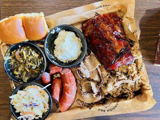 The Ultimate Platter. 3 meats, 4 ribs, and 3 sides. Of course, all meats were incredibly tender & full of flavor. Try their BBQ sauces!