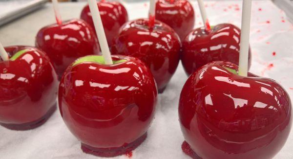 Candy apples being made on premises. The caramel peanut candy apple is super good.