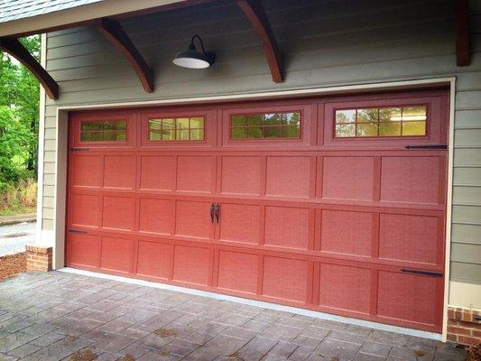 Wayne Dalton model 9700 steel carriage door painted red.