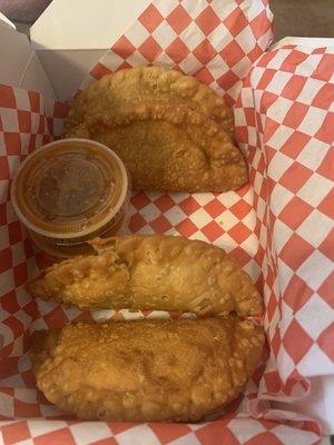 4 Roasted chicken empanadas with the Tastiest Hot Sauce!!!