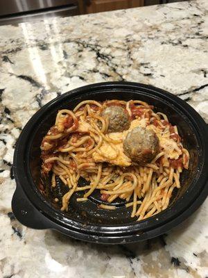 Spaghetti & Meatballs with a hint marinara sauce on top of the noodles but no sauce (you see no red below the top) throughout the bowl