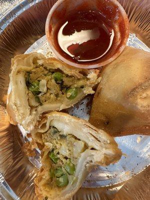 Vegetable samosa with sweet red sauce