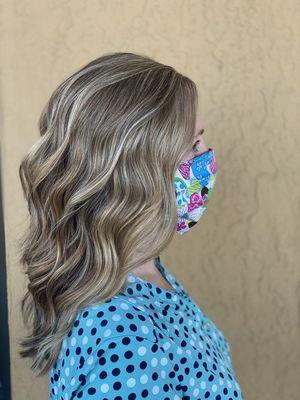 Partial highlights and a beachy wave style by Shamine Adams.