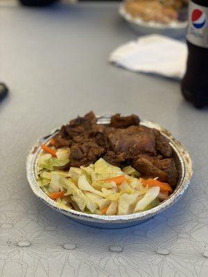 Brown stew chicken over vegetables