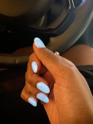 Glow in the dark dip nails in a dark garage.