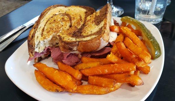 Reuben Sandwich with sweet potato fries.