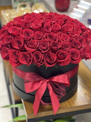 75 roses incorporated in a modern box.