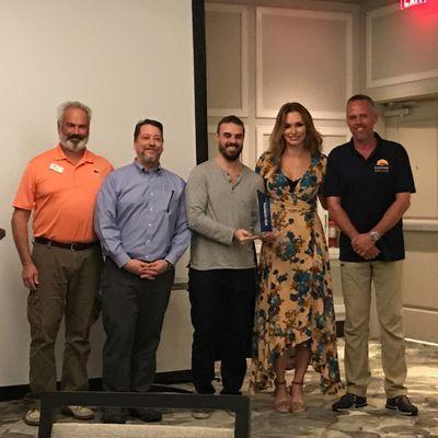 Owners Justin and Oxana accepting the President's Cup award at the 2018 Carefree Boat Club Conference.