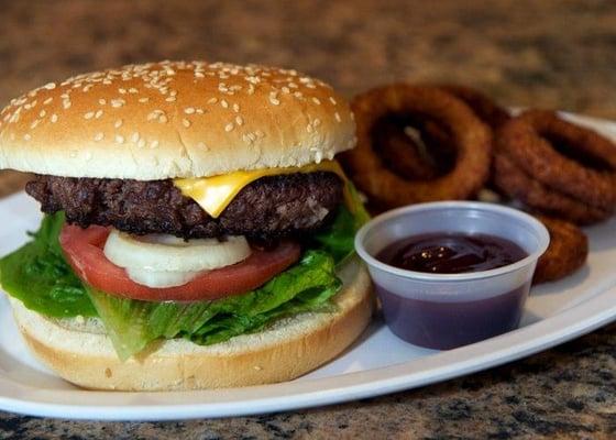 Delicious Cheese burger deluxe with Onion RIngs. One of my faves at Satyr Grill!