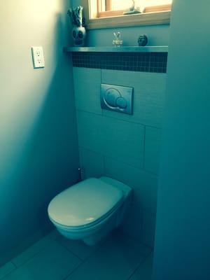 Installation of a wall-hung toilet.