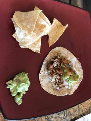 Chicken taco, chips and guacamole