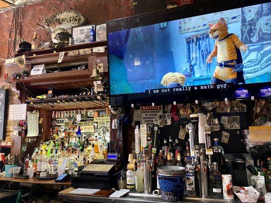 The bar and TV at Three Legged Dog Tavern