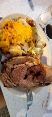 Cajun prime rib and American fries with cheese & onion