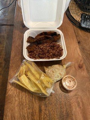 Complete and delicious meal! Grilled pork, plantains, rice and beans and salad.