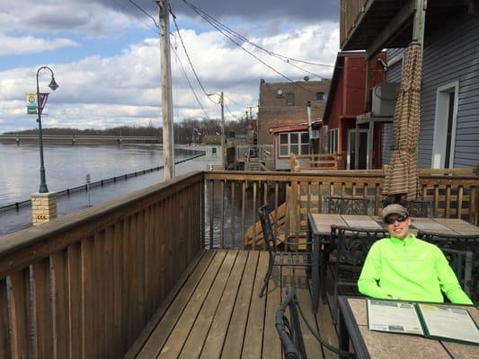 The water is so high we can see the river under our feet on the patio. Notice the one-way sign on the road.